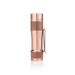 Lumintop FW1AA red copper EDC flashlight tail standing view stainless steel clip serial number engraving white background