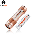 Lumintop FW3A copper flashlight with pocket clip beside a 2900mAh 18650 battery.