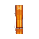 Lumintop FW3A orange aluminium flashlight standing upright, showing its knurled grip and pocket clip.