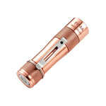 Lumintop FWAA copper EDC flashlight angled view tail electronic switch serial number engraved diamond knurling pocket clip