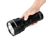 Lumintop Power 2.0 high power flashlight black hand held side view Lumintop logo side switch blue indicator light heat sink fins grip size comparison white background